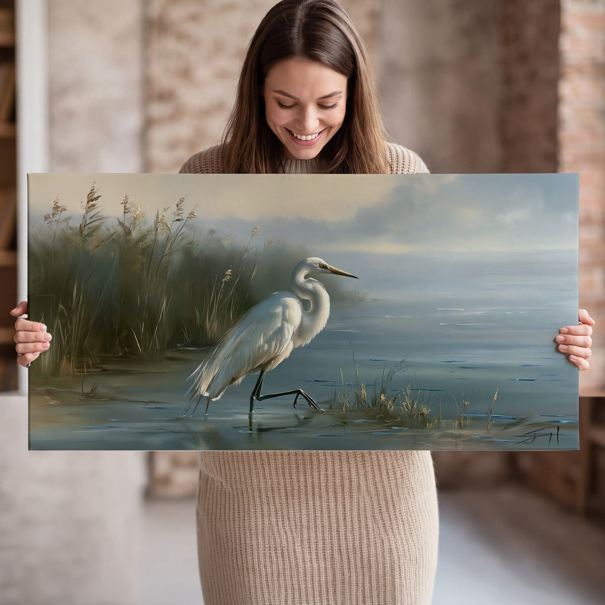 A white heron beside tall marsh grasses and still blue water single canvas wall art held in hands