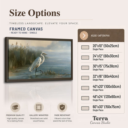 A white heron beside tall marsh grasses and still blue water single framed canvas wall art available dimensions