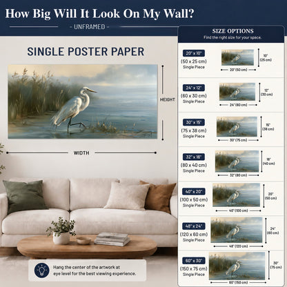 A white heron beside tall marsh grasses and still blue water single poster print size guide above a sofa; room view is illustrative