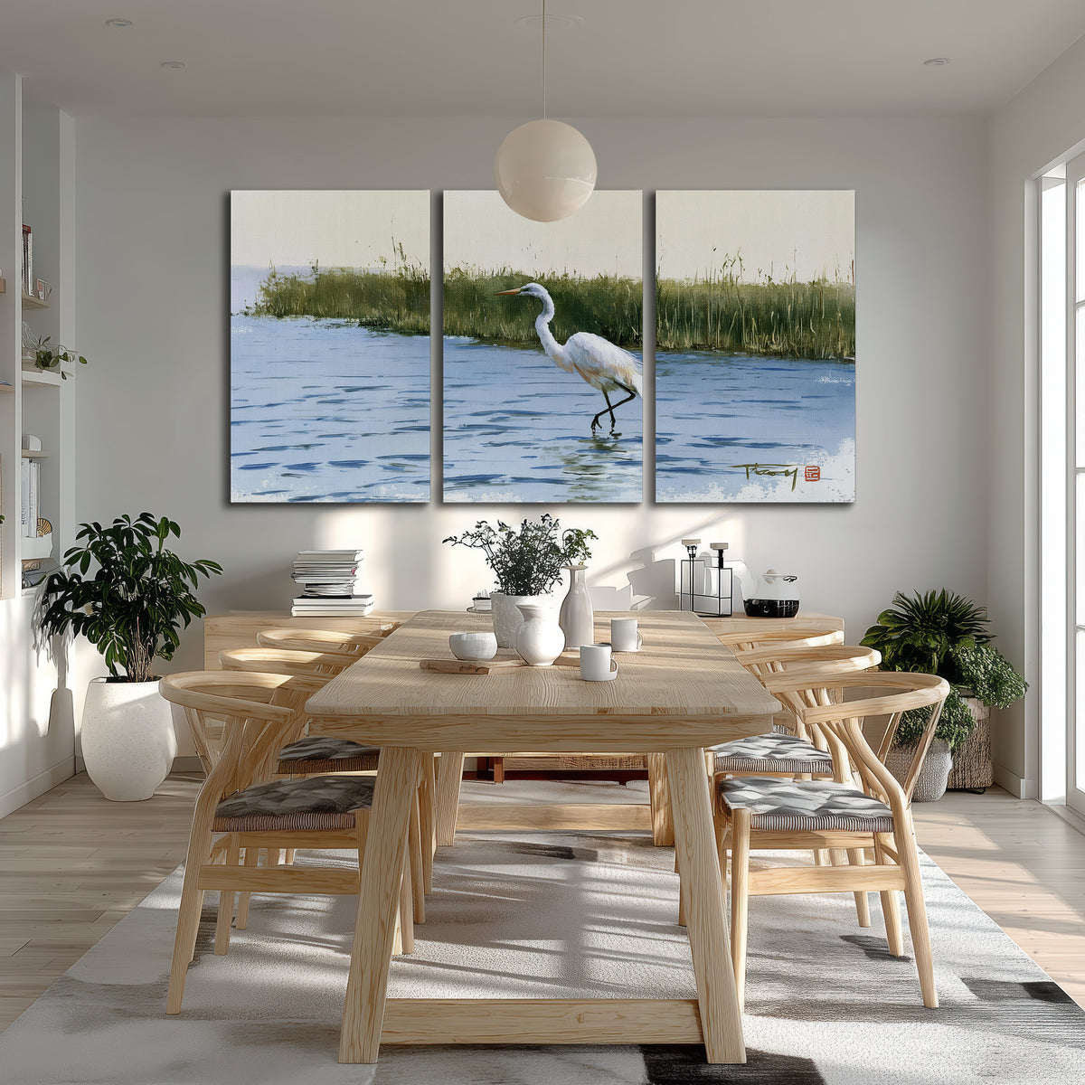 A white heron wading through bright blue water beside green reeds 3 piece canvas wall art room and product view