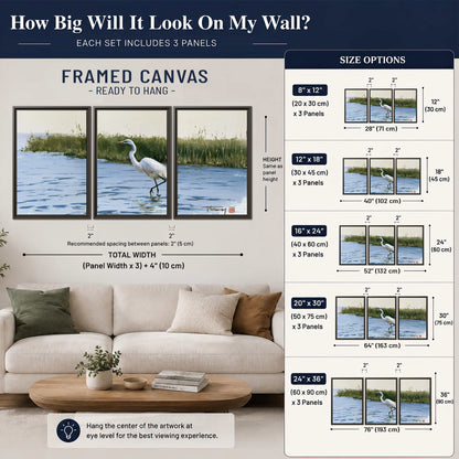 A white heron wading through bright blue water beside green reeds 3 piece framed canvas wall art size guide above a sofa; room view is illustrative