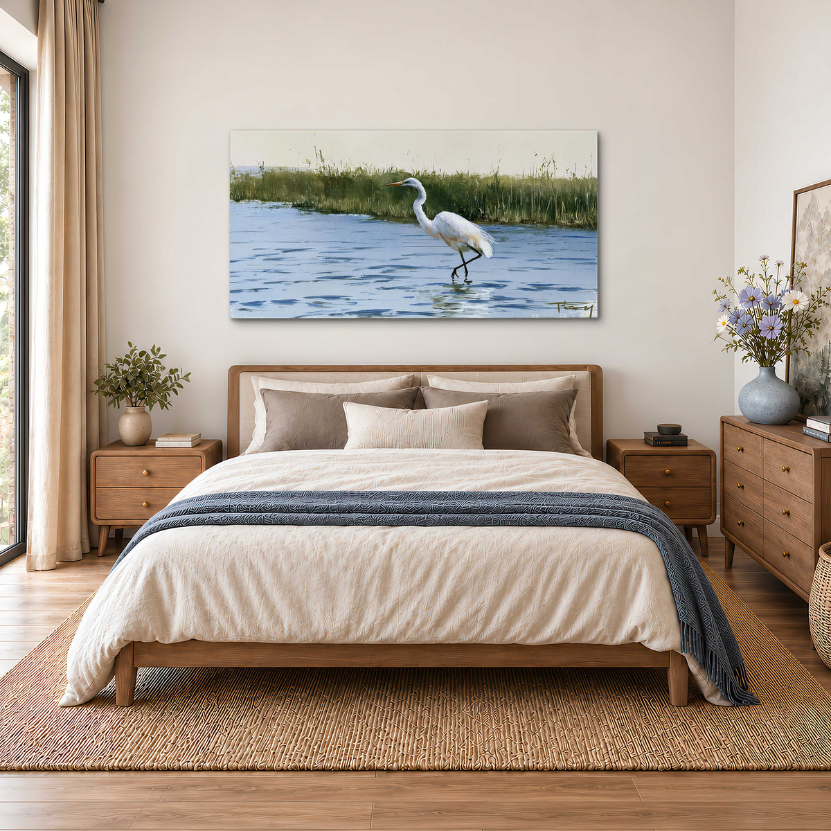 A white heron wading through bright blue water beside green reeds single canvas wall art styled in an interior