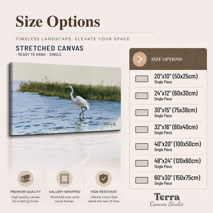 A white heron wading through bright blue water beside green reeds single canvas wall art available dimensions