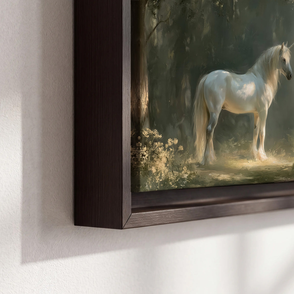 A white unicorn standing beneath arching trees in a softly lit woodland 3 piece framed canvas wall art material and edge close up