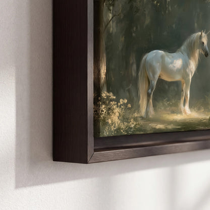 A white unicorn standing beneath arching trees in a softly lit woodland 3 piece framed canvas wall art material and edge close up
