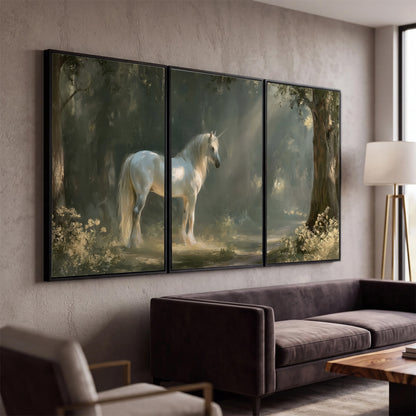 A white unicorn standing beneath arching trees in a softly lit woodland 3 piece framed canvas wall art displayed in a modern living room