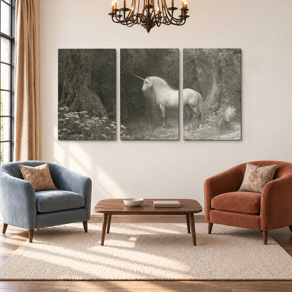 A pale unicorn surrounded by fine gray woodland branches and soft mist 3 piece canvas wall art styled in an interior