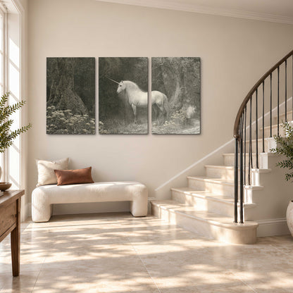A pale unicorn surrounded by fine gray woodland branches and soft mist 3 piece canvas wall art styled in an interior