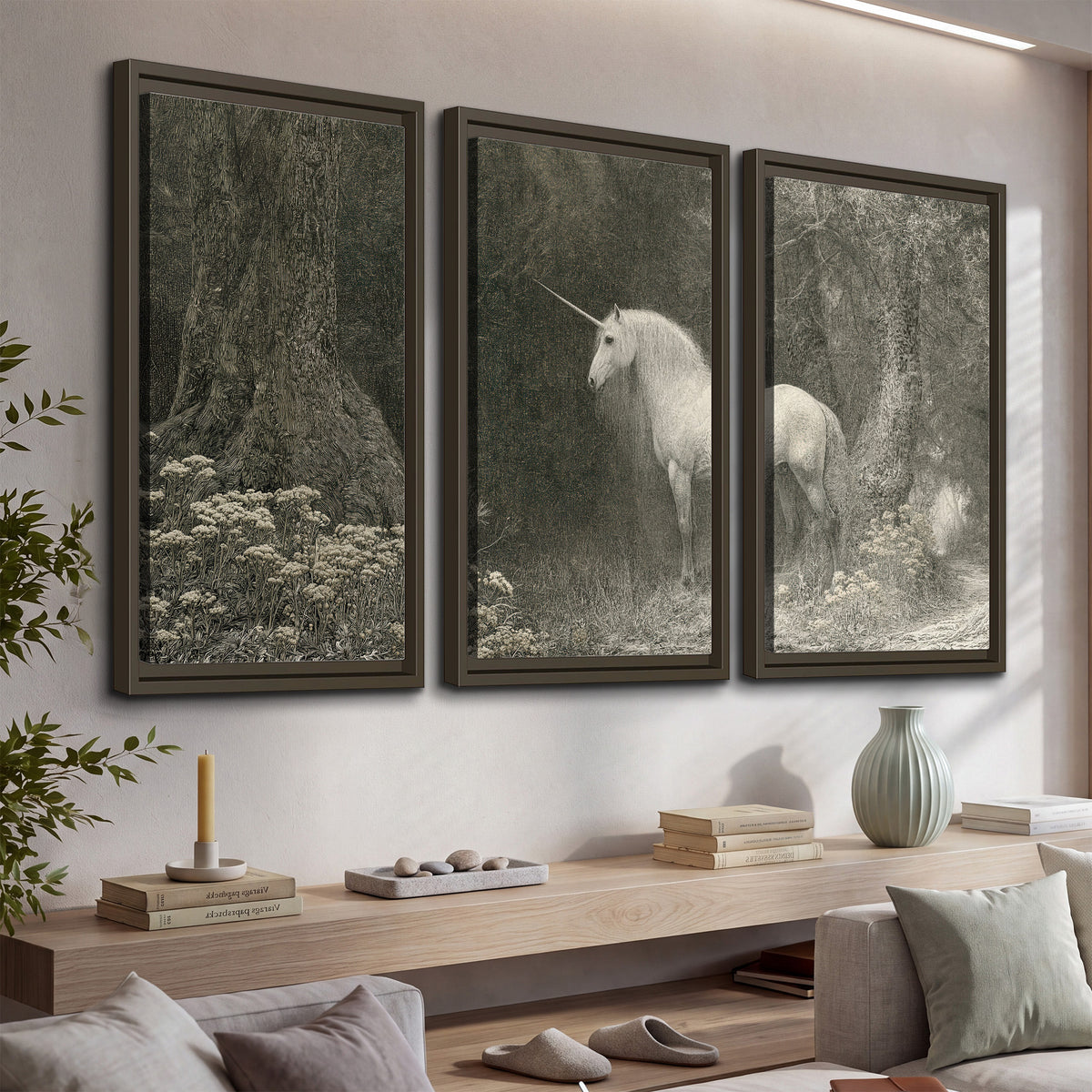 A pale unicorn surrounded by fine gray woodland branches and soft mist 3 piece framed canvas wall art displayed in a console
