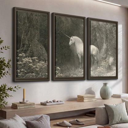 A pale unicorn surrounded by fine gray woodland branches and soft mist 3 piece framed canvas wall art displayed in a console