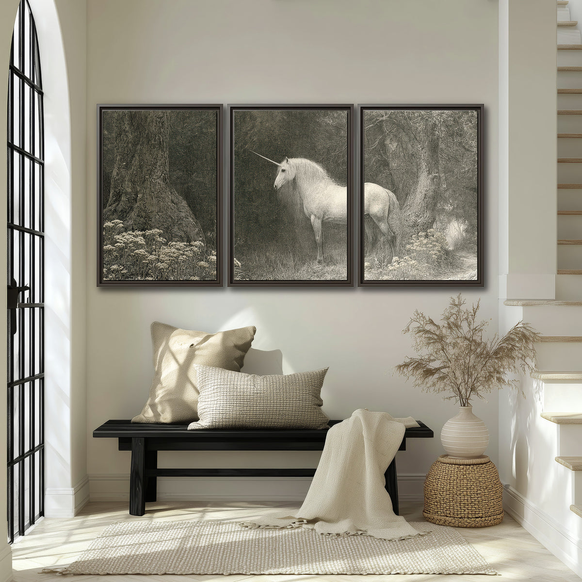 A pale unicorn surrounded by fine gray woodland branches and soft mist 3 piece framed canvas wall art displayed in a entryway