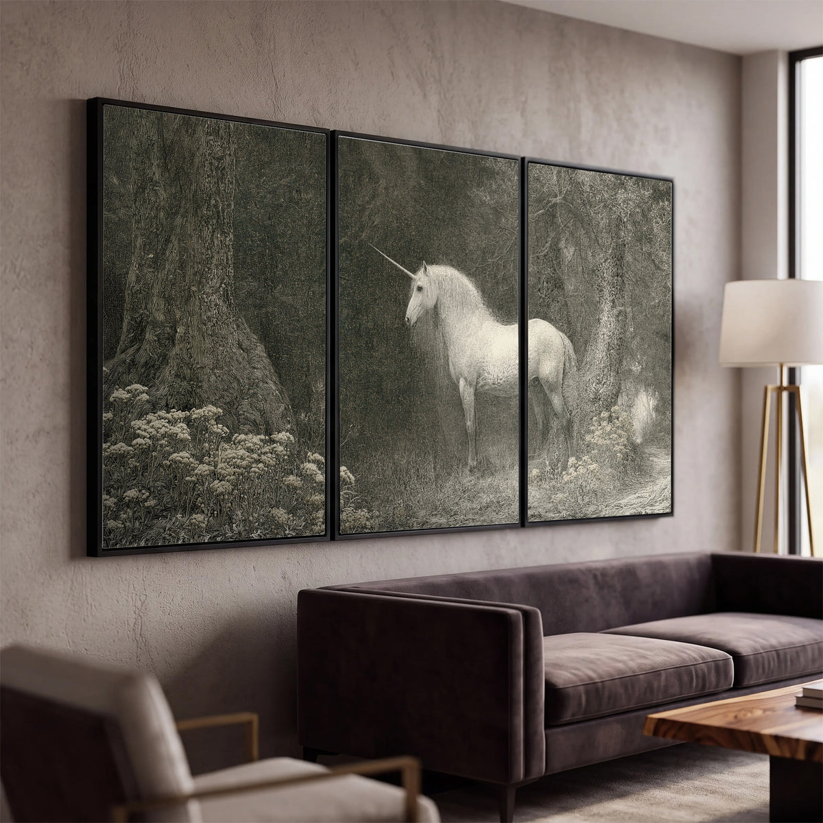 A pale unicorn surrounded by fine gray woodland branches and soft mist 3 piece framed canvas wall art displayed in a modern living room
