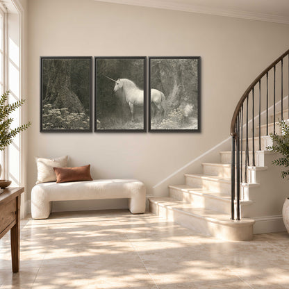 A pale unicorn surrounded by fine gray woodland branches and soft mist 3 piece framed canvas wall art styled in an interior
