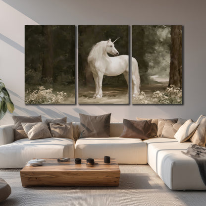 A white unicorn standing in a shadowed forest clearing among dark tree trunks 3 piece canvas wall art displayed in a living room