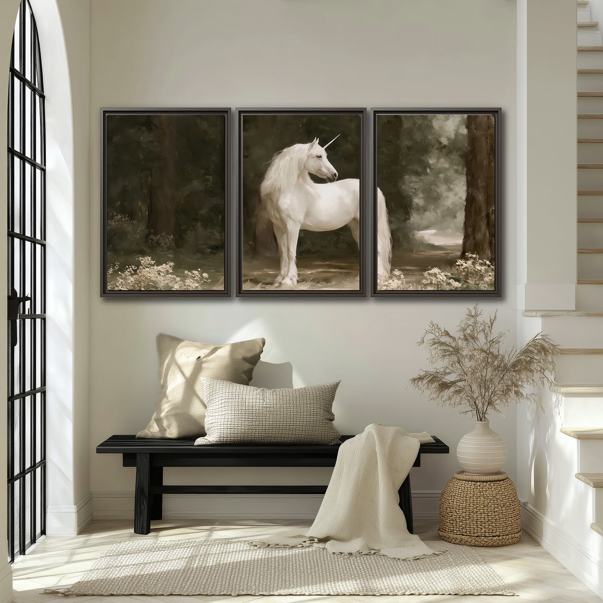 A white unicorn standing in a shadowed forest clearing among dark tree trunks 3 piece framed canvas wall art displayed in a entryway