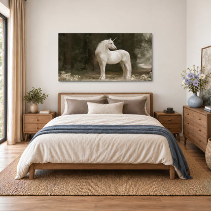 A white unicorn standing in a shadowed forest clearing among dark tree trunks single canvas wall art styled in an interior