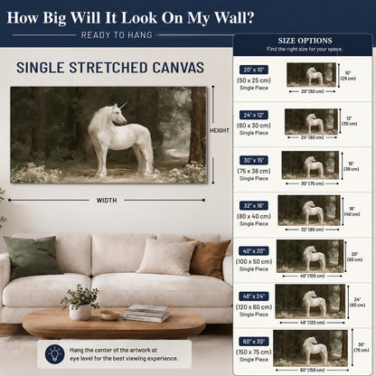 A white unicorn standing in a shadowed forest clearing among dark tree trunks single canvas wall art size guide above a sofa; room view is illustrative