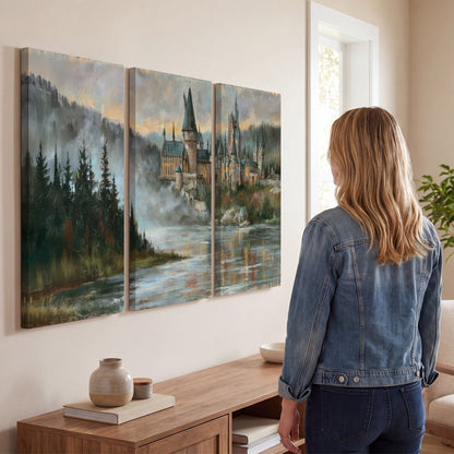 A storybook castle on a wooded riverbank beneath a cool misty sky 3 piece canvas wall art three panel arrangement on a wall