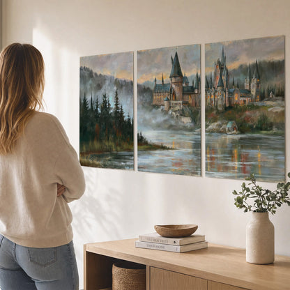A storybook castle on a wooded riverbank beneath a cool misty sky set of 3 poster prints three panel arrangement on a wall