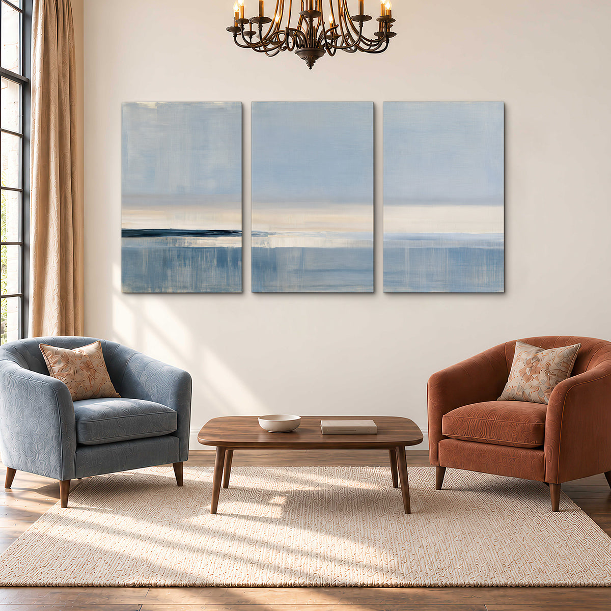 A minimal blue seascape with a pale horizon and soft vertical reflections 3 piece canvas wall art styled in an interior