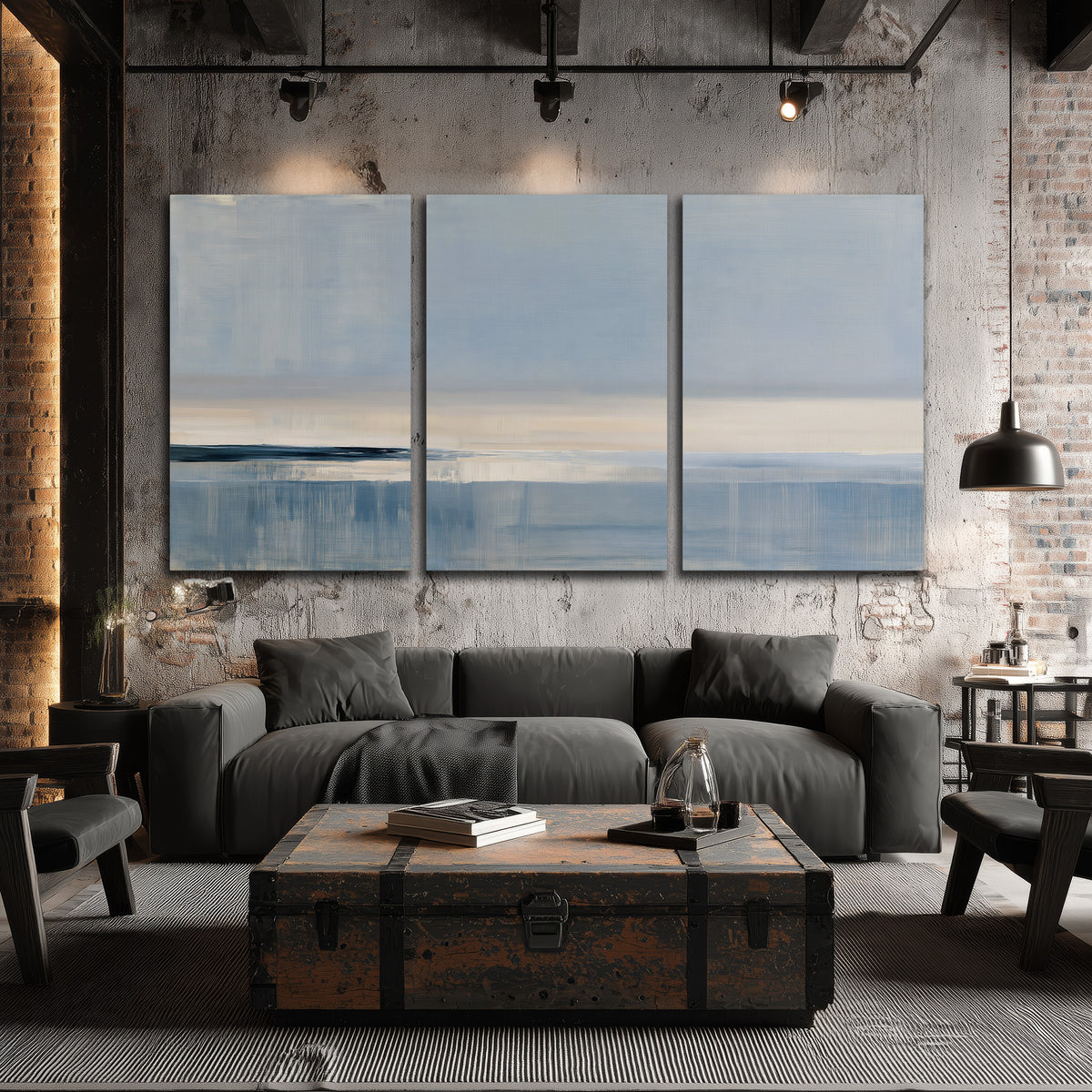 A minimal blue seascape with a pale horizon and soft vertical reflections 3 piece canvas wall art displayed in a industrial room