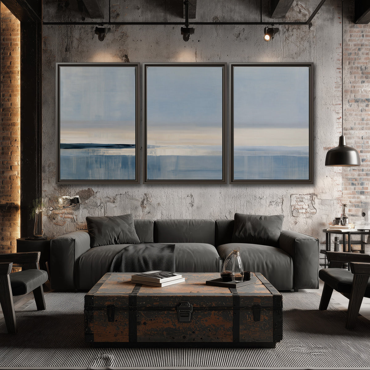 A minimal blue seascape with a pale horizon and soft vertical reflections 3 piece framed canvas wall art displayed in a industrial room