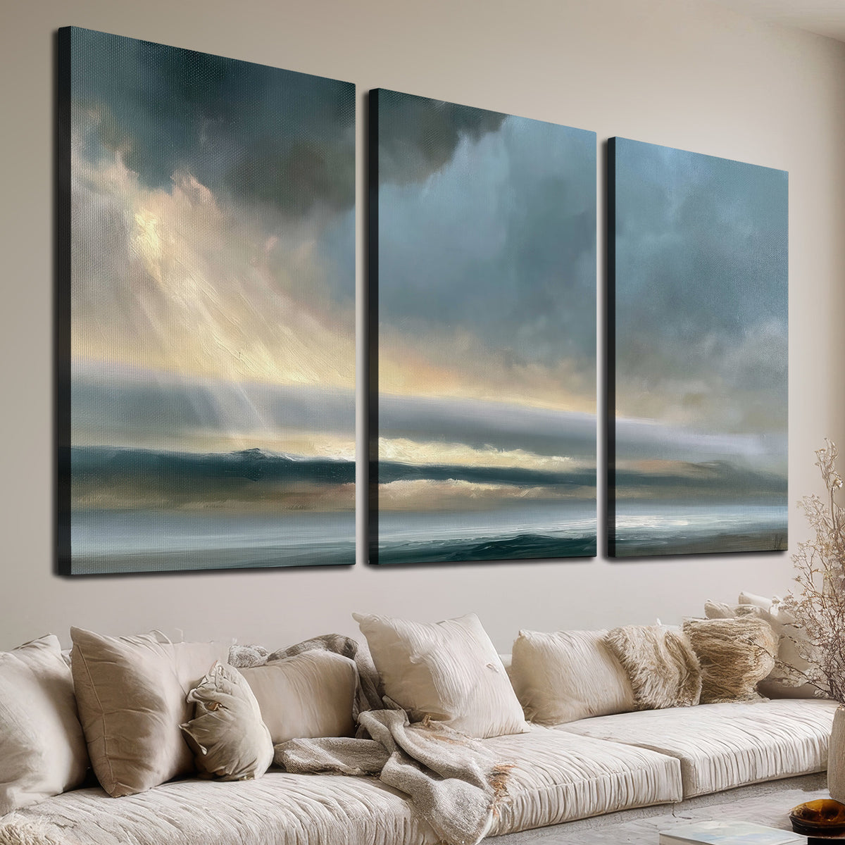 Dramatic blue-gray storm clouds breaking over a pale strip of ocean light 3 piece canvas wall art room and product view