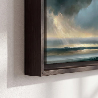 Dramatic blue-gray storm clouds breaking over a pale strip of ocean light 3 piece framed canvas wall art material and edge close up