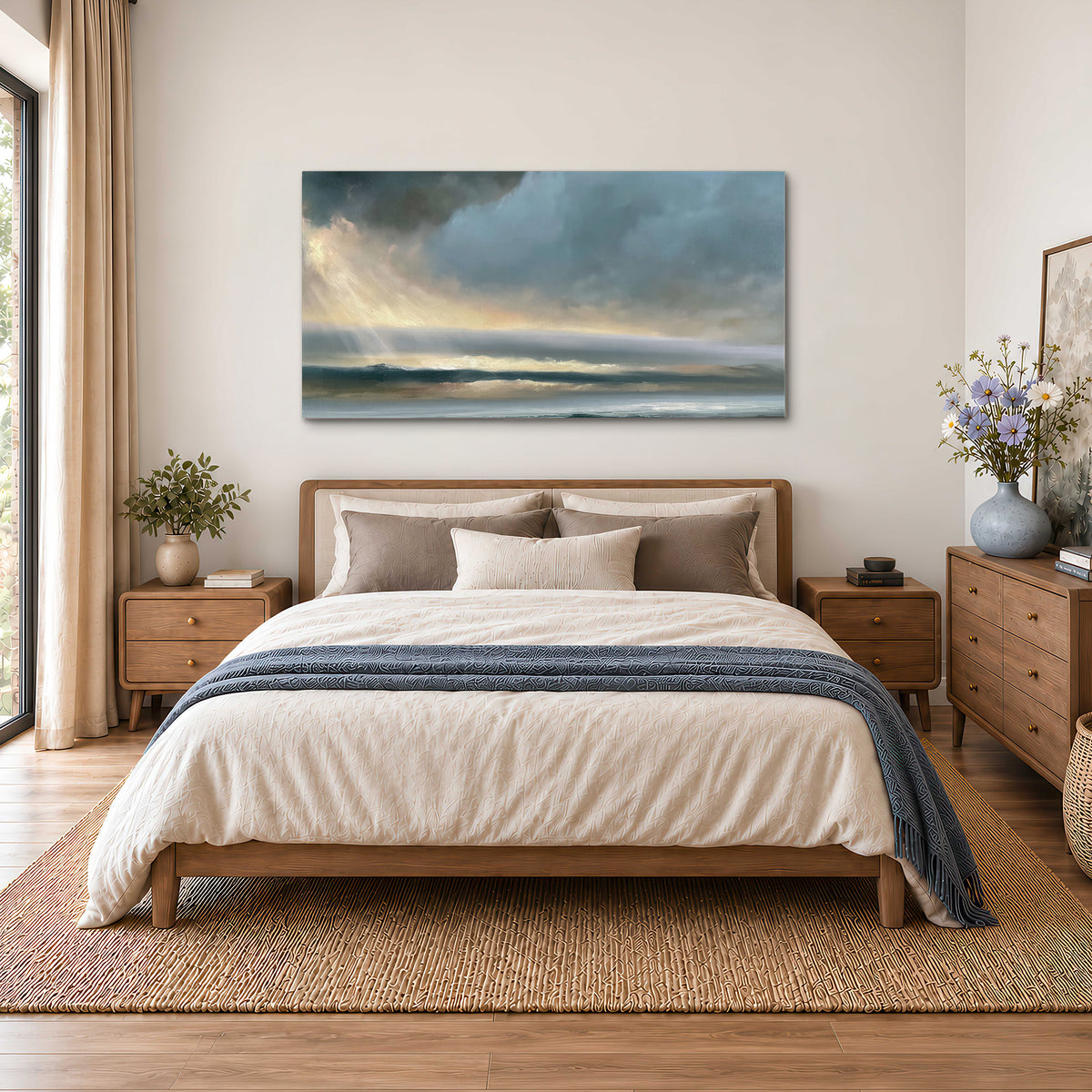 Dramatic blue-gray storm clouds breaking over a pale strip of ocean light single canvas wall art styled in an interior