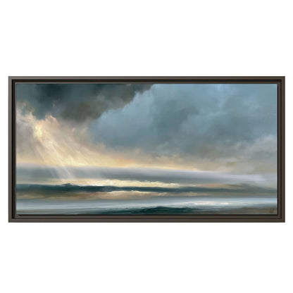 Dramatic blue-gray storm clouds breaking over a pale strip of ocean light single framed canvas wall art viewed straight on