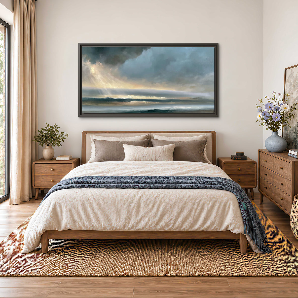 Dramatic blue-gray storm clouds breaking over a pale strip of ocean light single framed canvas wall art styled in an interior