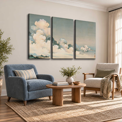 Soft cream clouds gathered low in a muted blue-green sky 3 piece canvas wall art styled in an interior
