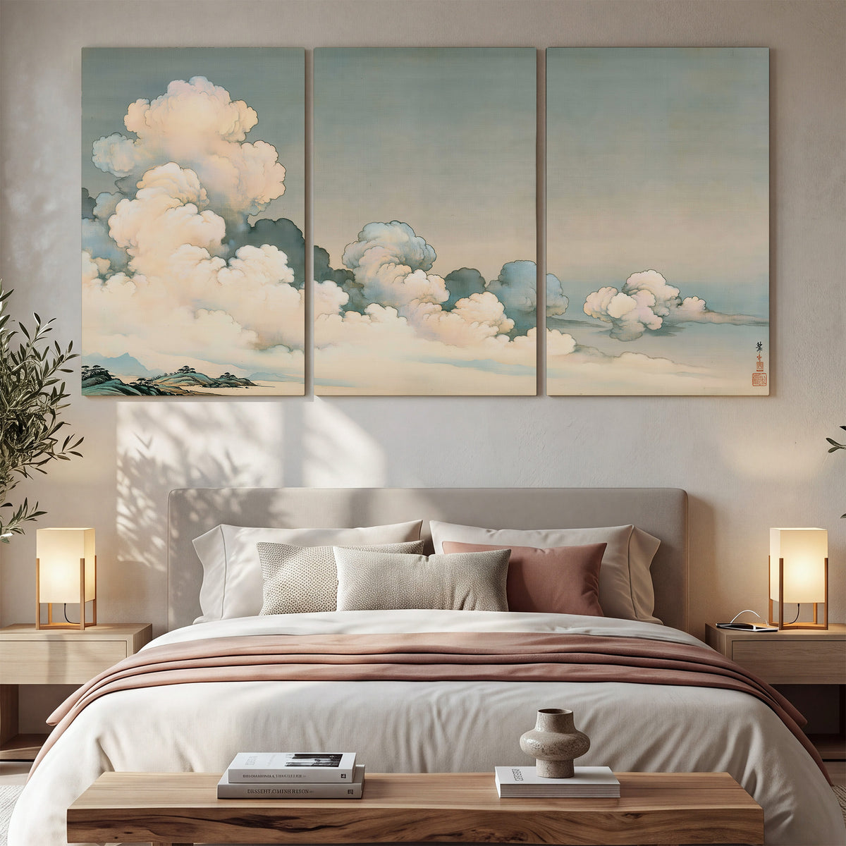 Soft cream clouds gathered low in a muted blue-green sky 3 piece canvas wall art displayed in a bedroom