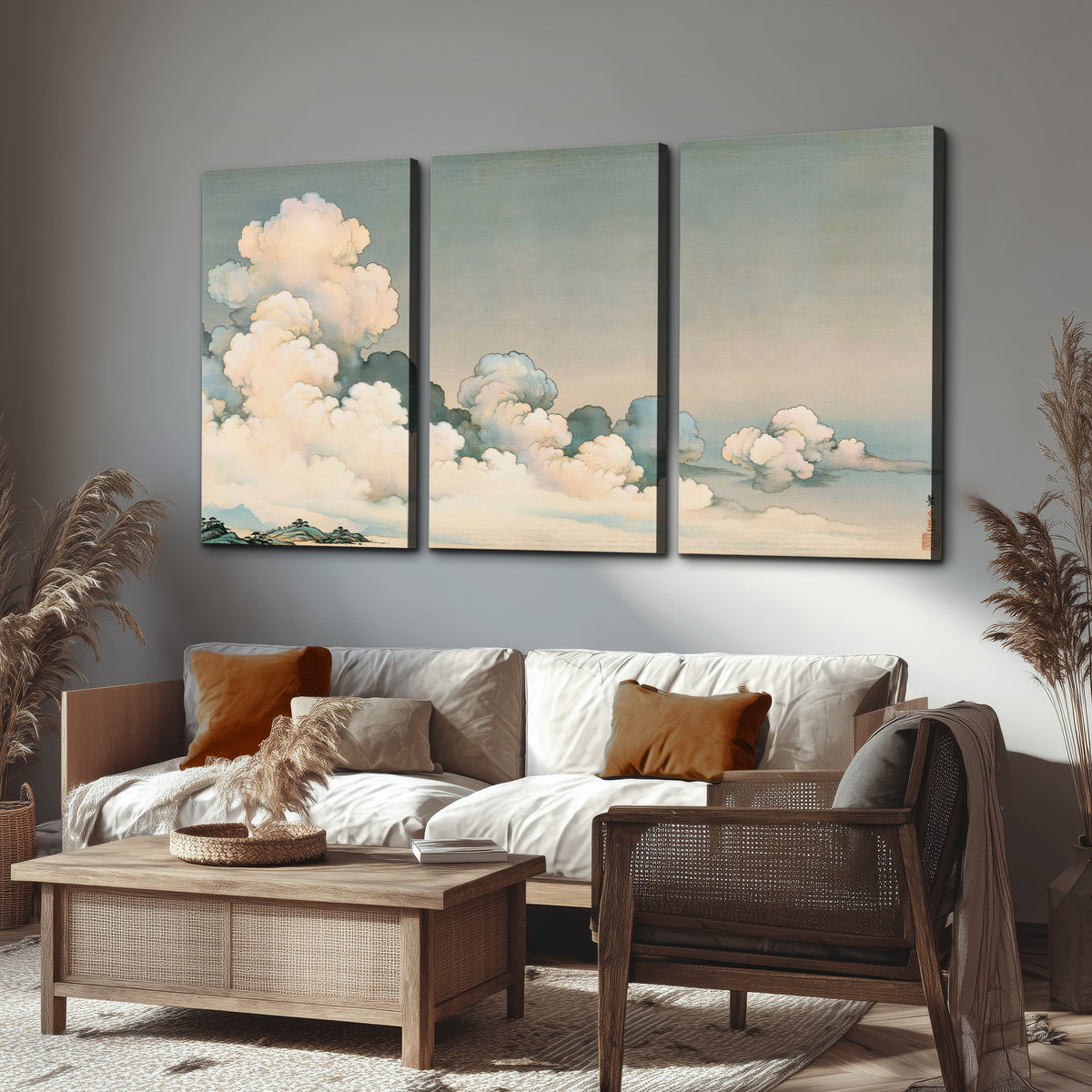 Soft cream clouds gathered low in a muted blue-green sky 3 piece canvas wall art displayed in a rustic living room