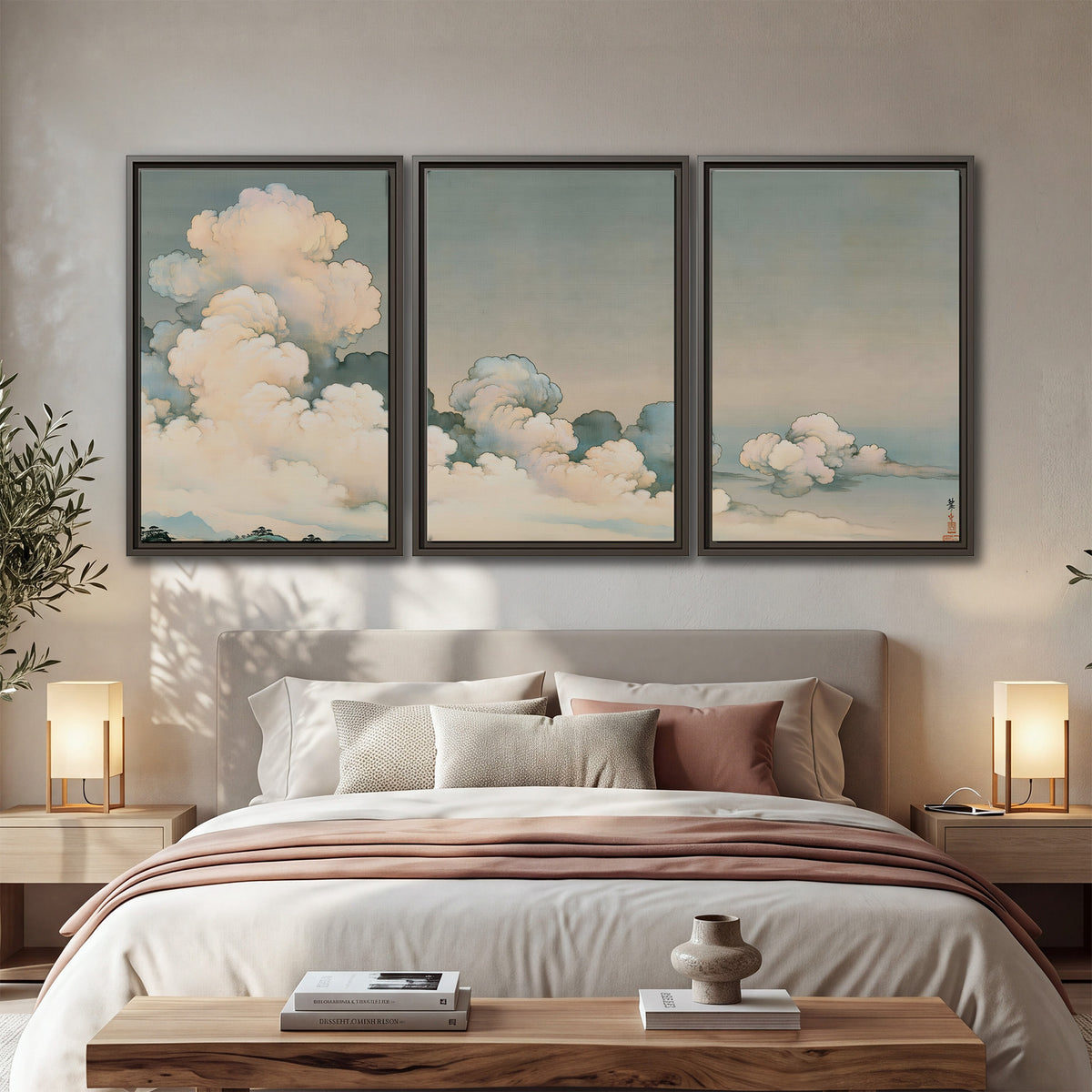 Soft cream clouds gathered low in a muted blue-green sky 3 piece framed canvas wall art displayed in a bedroom