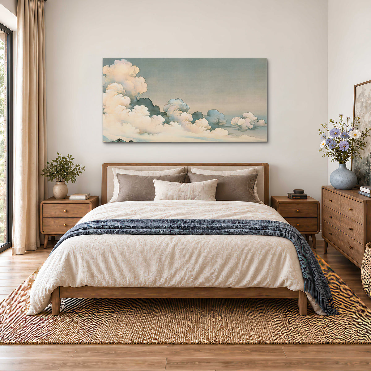 Soft cream clouds gathered low in a muted blue-green sky single canvas wall art styled in an interior