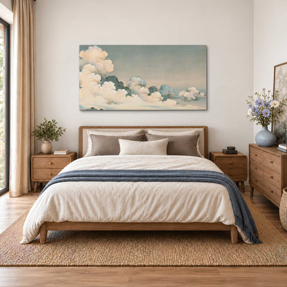 Soft cream clouds gathered low in a muted blue-green sky single canvas wall art styled in an interior