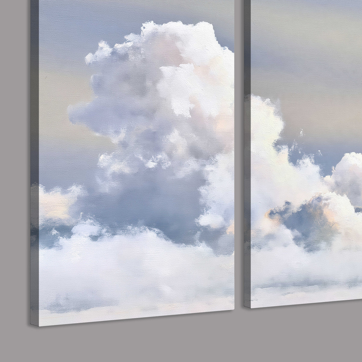 Large white clouds rising through a pale blue sky with gentle warm highlights 3 piece canvas wall art room and product view