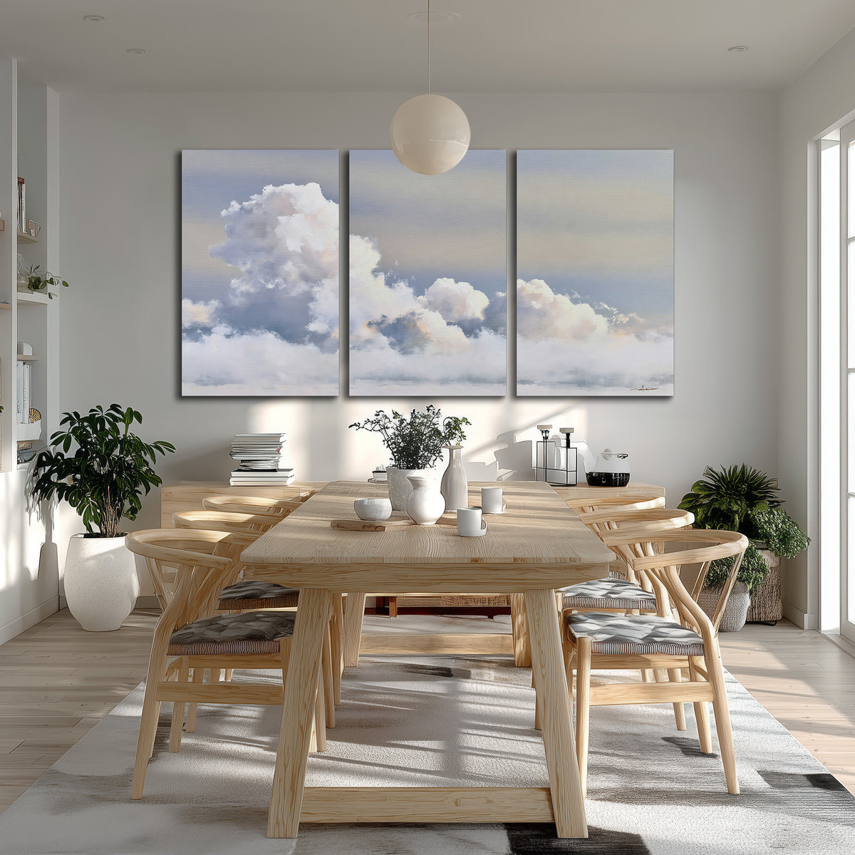 Large white clouds rising through a pale blue sky with gentle warm highlights 3 piece canvas wall art room and product view