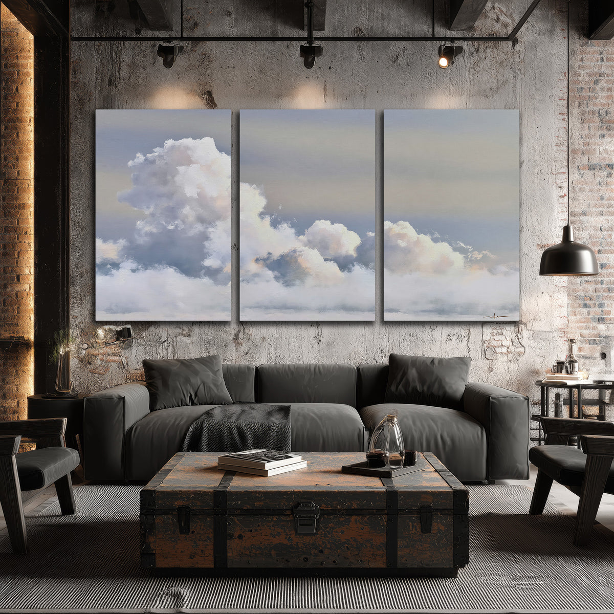 Large white clouds rising through a pale blue sky with gentle warm highlights 3 piece canvas wall art displayed in a industrial room