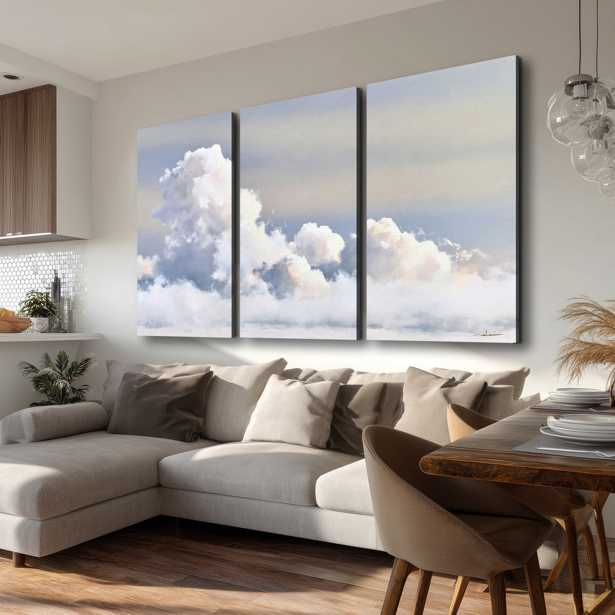 Large white clouds rising through a pale blue sky with gentle warm highlights 3 piece canvas wall art room and product view