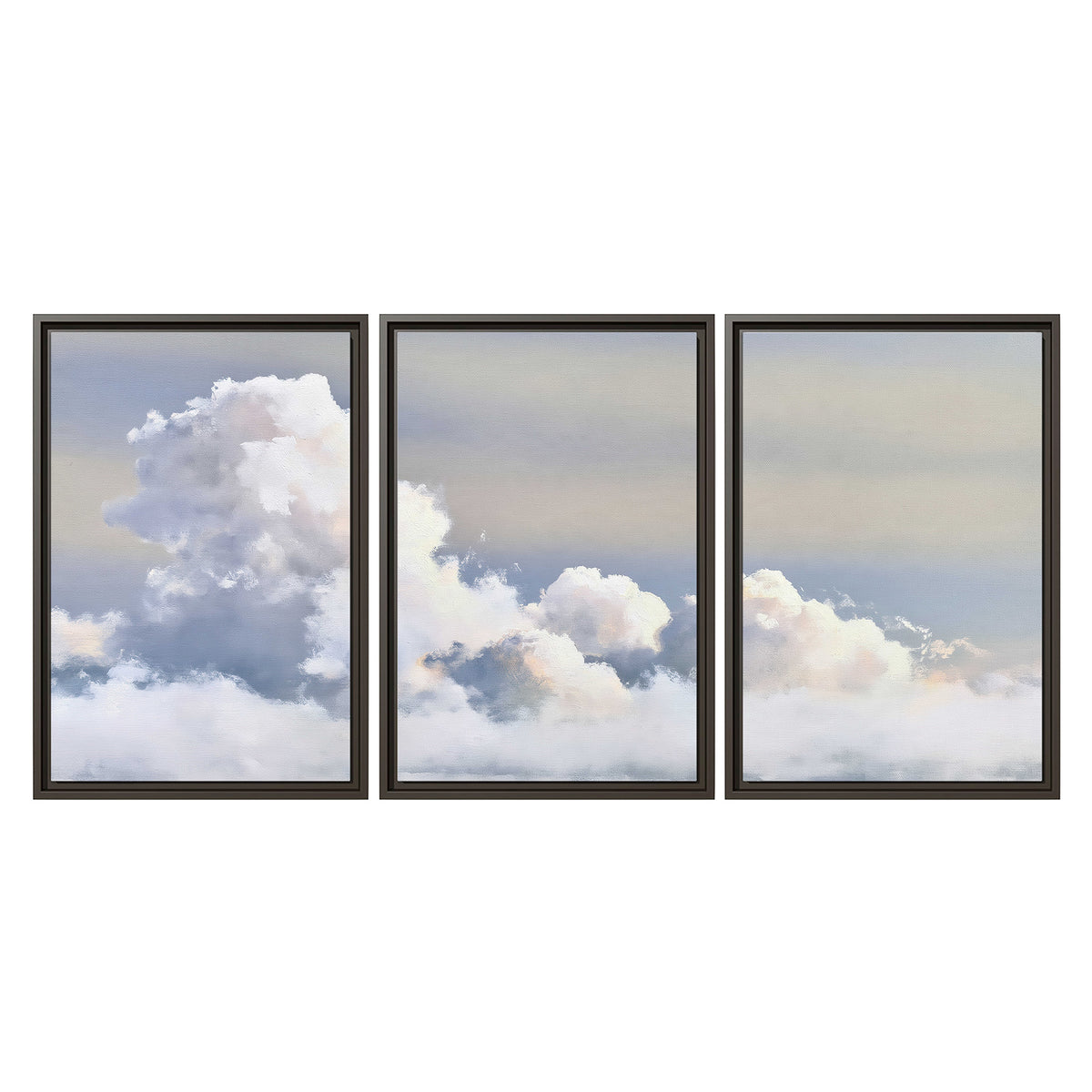 Large white clouds rising through a pale blue sky with gentle warm highlights 3 piece framed canvas wall art viewed straight on