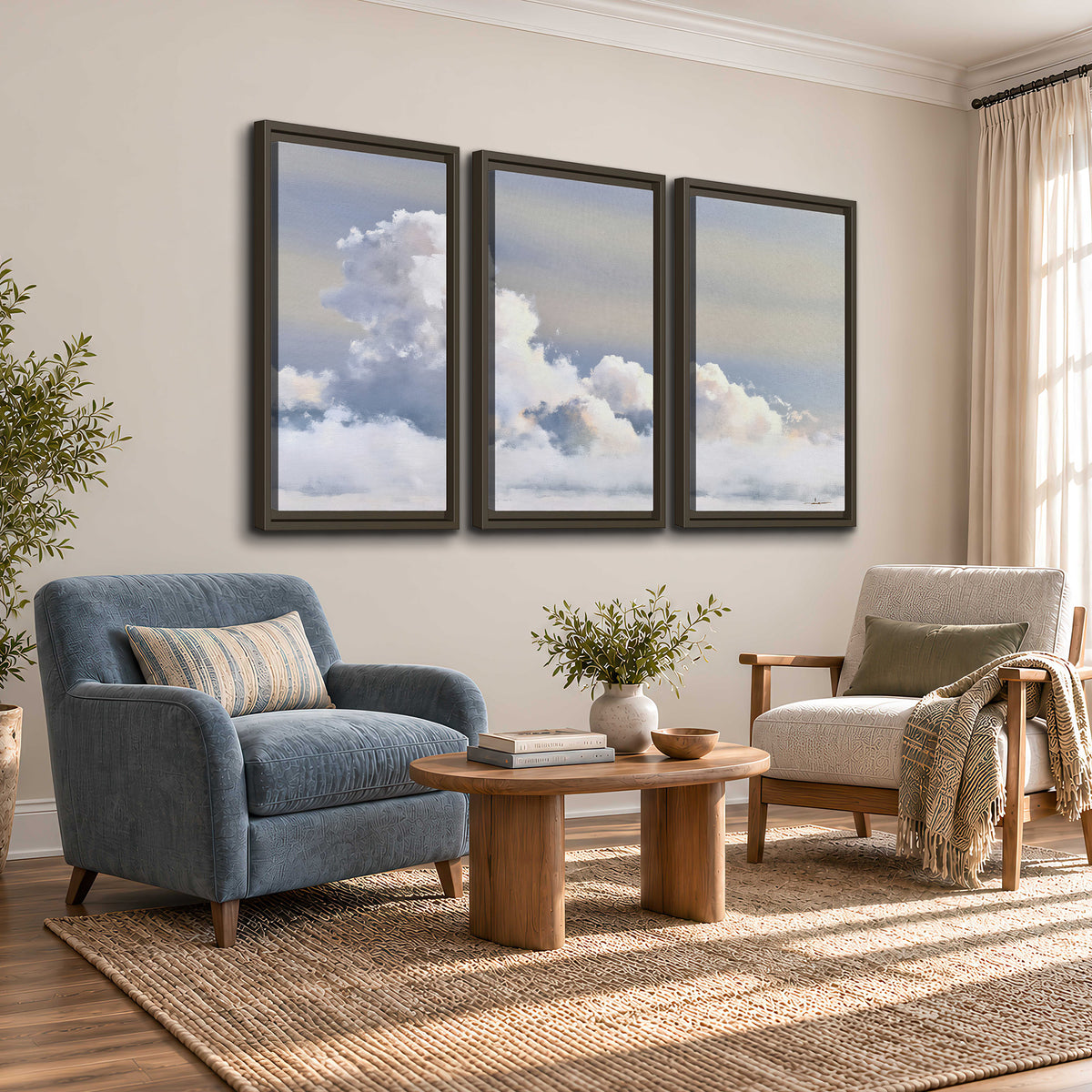 Large white clouds rising through a pale blue sky with gentle warm highlights 3 piece framed canvas wall art styled in an interior