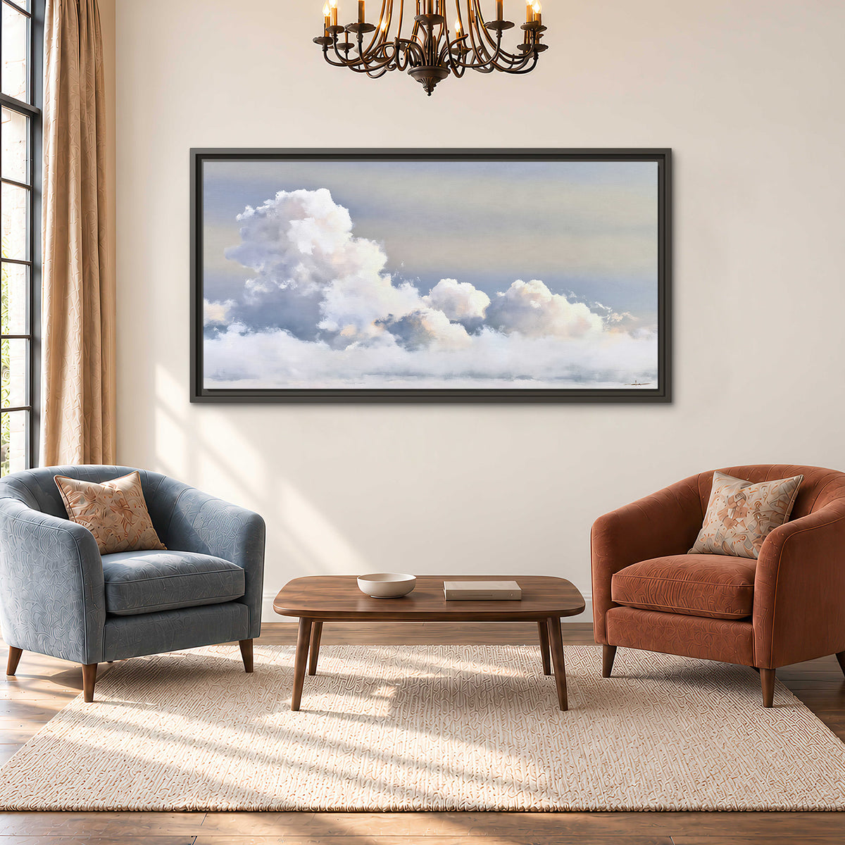 Large white clouds rising through a pale blue sky with gentle warm highlights single framed canvas wall art styled in an interior