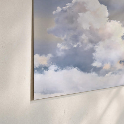 Large white clouds rising through a pale blue sky with gentle warm highlights set of 3 poster prints material and edge close up