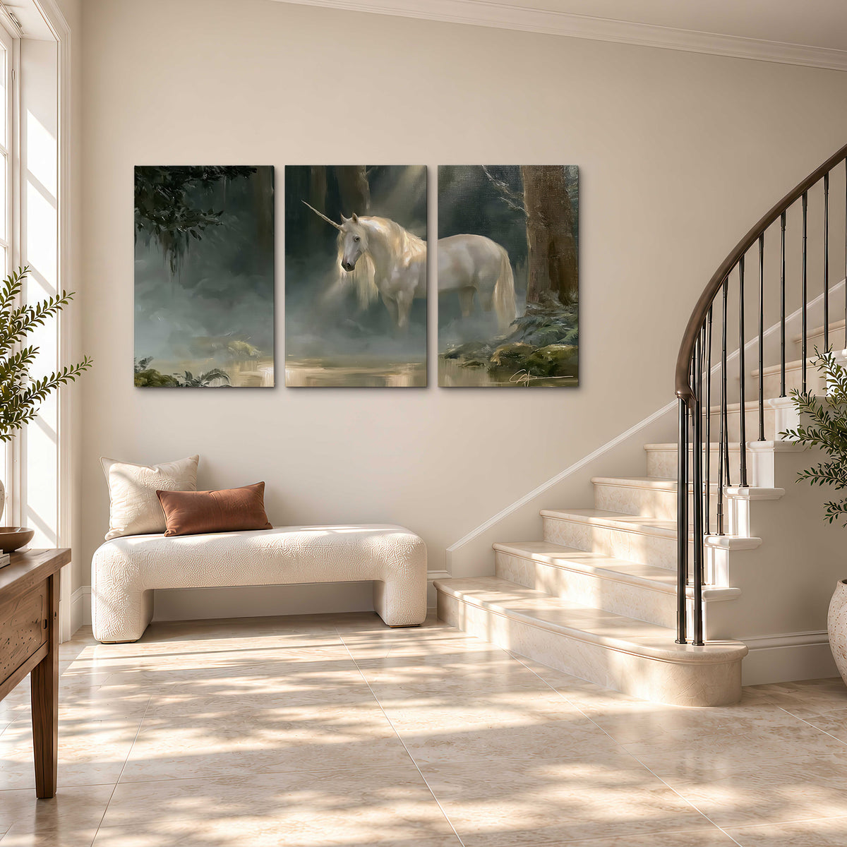 A white unicorn standing near rocks and a quiet stream in a green woodland 3 piece canvas wall art styled in an interior