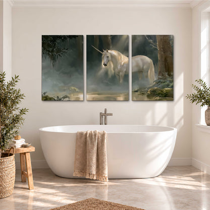 A white unicorn standing near rocks and a quiet stream in a green woodland 3 piece canvas wall art styled in an interior