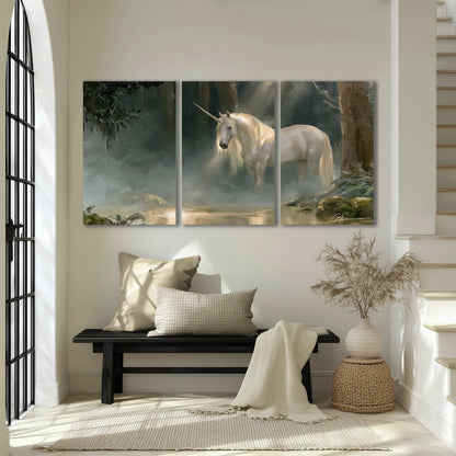 A white unicorn standing near rocks and a quiet stream in a green woodland 3 piece canvas wall art displayed in a entryway