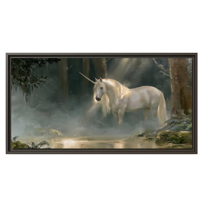A white unicorn standing near rocks and a quiet stream in a green woodland single framed canvas wall art viewed straight on