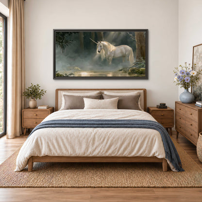 A white unicorn standing near rocks and a quiet stream in a green woodland single framed canvas wall art styled in an interior